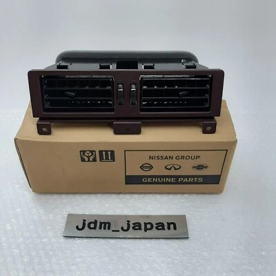 Nissan 68750-23G02 1987-92 Pathfinder rojo central aire acondicionado rejilla de ventilación genuina nueva Foto 1 de 4