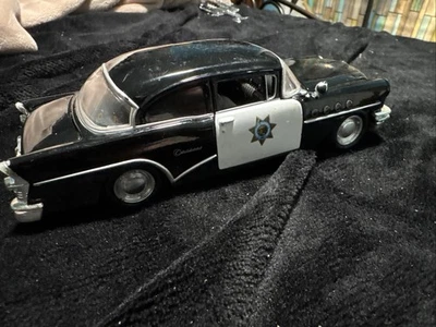 1955 BUICK CENTURY POLICE CAR BLACK & WHITE 1/26 DIECAST MODEL BY MAISTO 31295 - Image 1 of 4