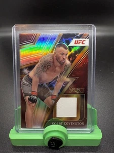 2023 Panini Select UFC Colby Covington Sparks #SP-CCV Memorabilia - Picture 1 of 1
