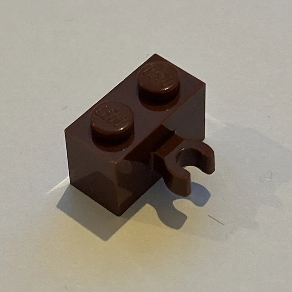 1x LEGO® 6330202 - 30237b - Stein, modifiziert 1 x 2 Rotbraun - Bild 1 von 1