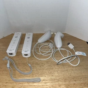 2 Official Nintendo Wii Remotes White and Nunchucks - Picture 1 of 8