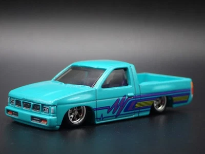 Modello Auto Diecast 1:64 Nissan Hardbody Pickup Truck D21 Teal 1993 - Immagine 1 di 4