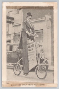 Stilt Walker in Top Hat Rides Stilt Bicycle Advertising Cambridge Fair Postcard - Picture 1 of 5