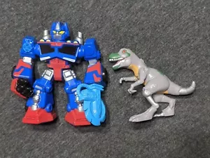 Transformers RESCUE BOTS Figure 2-Pack OPTIMUS PRIME (Blue) and T-REX (Dinosaur) - Picture 1 of 2