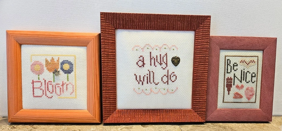 3 Wood Framed Handmade Cross Stitch "Be Nice,A Hug Will Do, Bloom" With Trinkets - Image 1 of 4