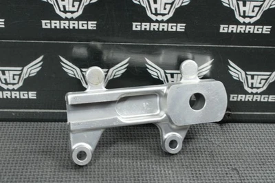 2003 SUZUKI RM85 RM85L OEM REAR BRAKE CALIPER HANGER BACK MOUNTING BRACKET - Image 1 of 4