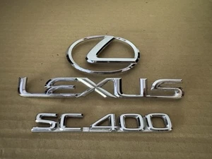 ENVÍO GRATUITO OEM 92-97 LEXUS SC 400 JUEGO DE INSIGNIAS EMBLEMA TRASERO - Imagen 1 de 7
