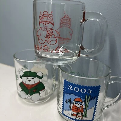 3 Vintage Marshall Field’s Santabear Glass Christmas Mug- 1986, 2003, 2004 - Image 1 of 4