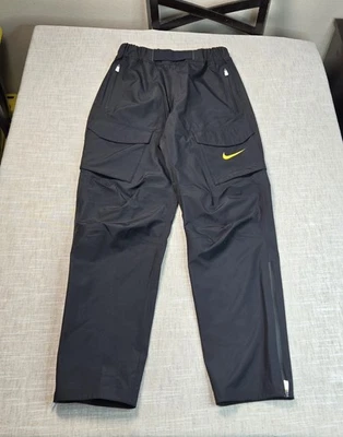 Pantalones cargo NIKE Pro Elite Storm Fit Uganda pequeños para hombre negros amarillos campo de atletismo Foto 1 de 4