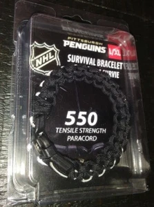 PULSERA DE SUPERVIVENCIA CON LICENCIA DE HOCKEY NHL NUEVO EN PAQUETE PITTSBURGH PINGÜINS TALLA L/XL - Imagen 1 de 4