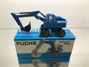 NZG 165 FUCHS 713 HYDRAULIC WHEEL EXCAVATOR BAGGER -BLUE 1:50- GOOD IN BOX - Imagen 1 de 8