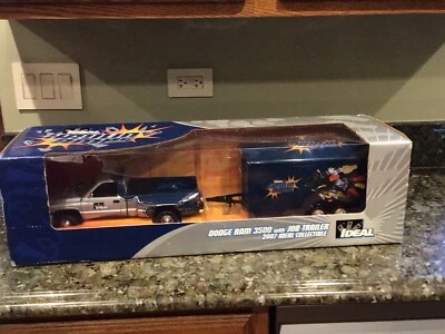 RC2 1/18 IDEAL BLUE/SILVER DODGE RAM 3500 DUALLY W/ TRAILER  Box slightly torn - Image 1 of 4