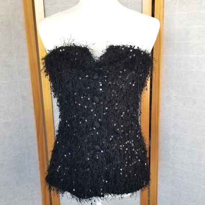 Top bustier negro con lentejuelas sin tirantes botón delantero elástico talla mediana de Zara Foto 1 de 4