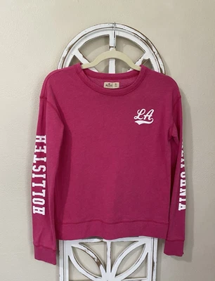 SUDADERA HOLLISTER XSMALL ROSA MANGAS HECHIZADAS LIGERA CUELLO REDONDO Foto 1 de 4