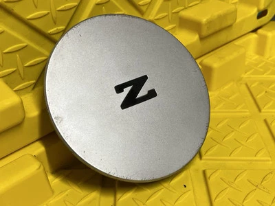 TAPA CENTRAL RUEDA NISSAN 300ZX OEM ACABADO PLATEADO PINTADO 1984-1989 40317-21P00 Foto 1 de 4