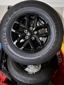 245/75/R17 Bridgestone Tires & Jeep Rims. Only A Few Miles On Them. With Bolts. - Picture 1 of 3