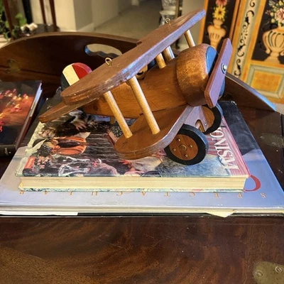Toy Wood Bi Plane With Pilot. Propeller And Wheels Turn.  11” L 13” Wingspan - Image 1 of 4