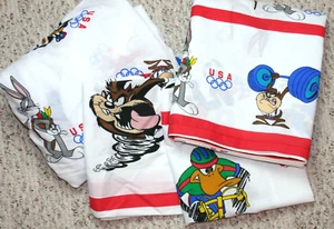 Set completo fogli Olimpiadi Looney Tunes vintage 4 pezzi insetti coniglietto Taz Daffy Sports US - Foto 1 di 11
