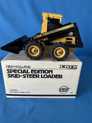 Minicargadora Ertl New Holland edición especial 1/16 #320-10TA Die-Cast 1986 Foto 1 de 4