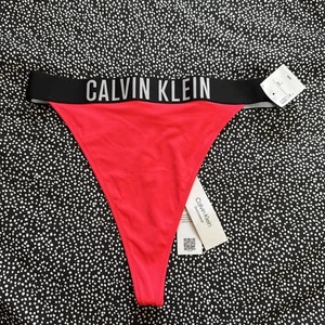 Calvin Klein Bikini Bottoms Thong Size large Brand New signal red - Picture 1 of 7