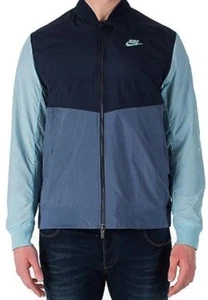 NUEVA CON ETIQUETAS PARA HOMBRE NIKE VARSITY FRANQUICIA TEJIDA Chaqueta de Lluvia Anorak Rompevientos en Azul - Imagen 1 de 5