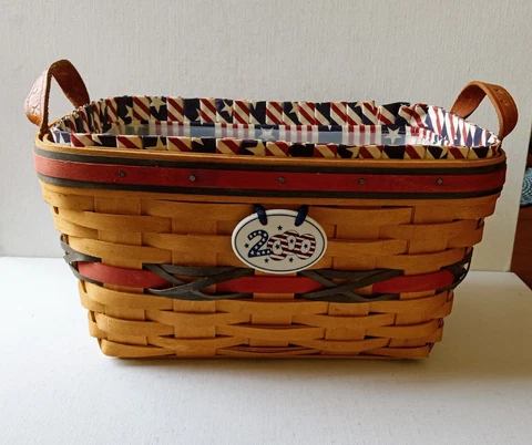 A Longaberger  Basket with  a ceramic tag "2000 Celebration" Signed & dated Cover