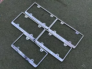 new genuine Tesla Chrome License Plate Frame (All Wheel Drive) PLASTIC LOT OF 5 - Bild 1 von 2