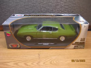 1/18 1969 PONTIAC GTO JUDGE HARDTOP , IN GREEN BY MOTOR MAX # 73100 - Picture 1 of 13