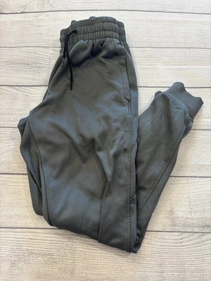 Pantalones deportivos Under Armour juveniles gris medio sueltos de vellón con puños Foto 1 de 4