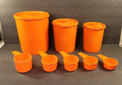 VINTAGE LOT OF 8 ORANGE TUPPERWARE CANNISTER AND MEASURING CUP WITH FLORAL PRINT - Image 1 of 4