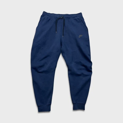 Pantalones deportivos Nike para hombre grandes azules tecnológicos polar Swoosh pierna cónica jogger Foto 1 de 4