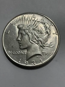 1934 D Peace Silver Dollar $1 E21 - Picture 1 of 2