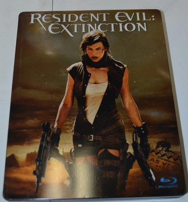 RESIDENT EXTINCTION.  2 DISCS-TIN BOX - Image 1 of 2