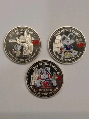 1999 China Year of Rabbit Macau Return to China Trade Dollar 3 Coin Colorize Set - Image 1 of 2