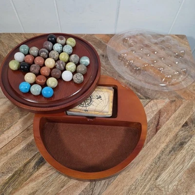  Juego solitario clásico de madera con 33 canicas minerales Foto 1 de 4