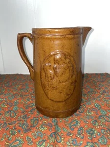 Jarra de gres marrón 1905-1925 “Niña con perro” - Imagen 1 de 14