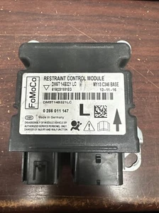 FORD FOCUS SRS CONTROL MODULE UNIT PN: DM5T 14B321 LC (P) - Picture 1 of 3