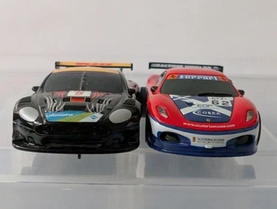 2 x Micro Scalextric Racing Cars 12V 1:64 Ferrari & Aston Martin Both are in VGC - Image 1 of 4