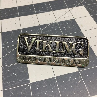 Viking OEM Black / Brass Gold Logo Nameplate PE010143 (3" x 1.25") - Some Wear - Image 1 of 4