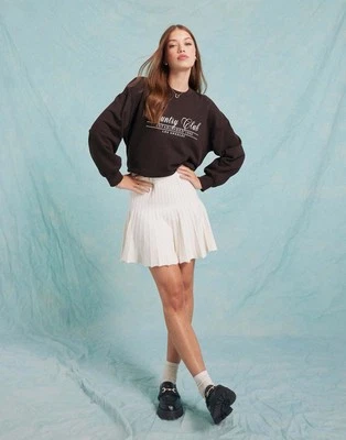 Minifalda Miss Selfridge plisada de punto flippy en crema talla 8-10 Foto 1 de 4