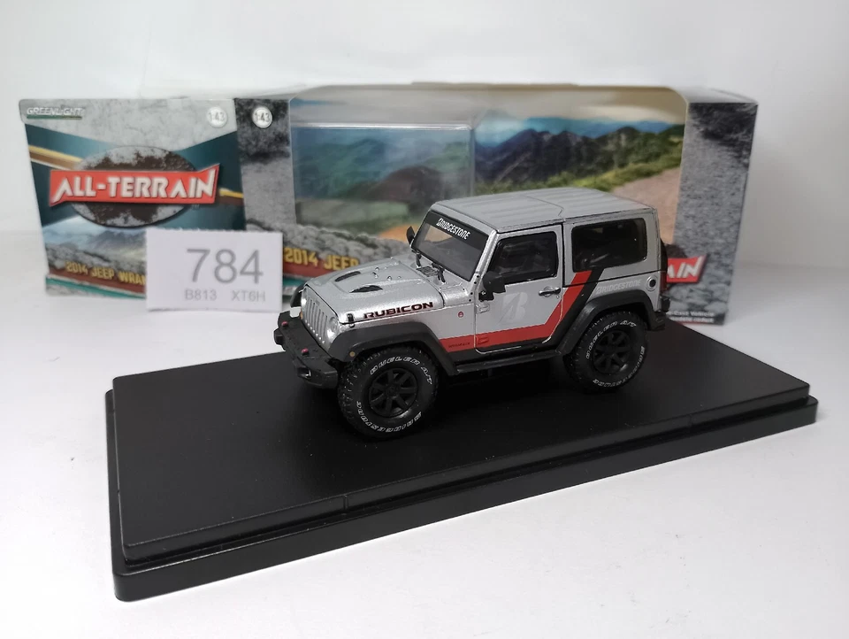 Jeep Wrangler Rubicon 2014 (1/43) todo terreno, Bridgestone, + caja, estuche y soporte Foto 1 de 4