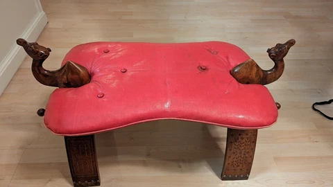 Vintage Wooden Camel Saddle foot stool with red cushion and brass caps Cover