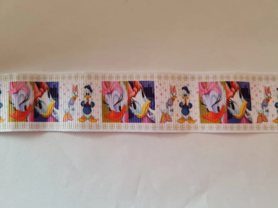 2 meters of Donald and Daisy Duck print grosgrain ribbon 1" wide - Image 1 of 1