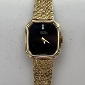 Reloj de pulsera vintage Seiko para mujer 1400-8349 esfera negra tono dorado trenzado - funciona - Imagen 1 de 6