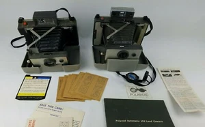 Polaroid 103 & 210 Land Camera Lot x2 mit Timer Model 128 *AS-IS* ungetestet* - Bild 1 von 10