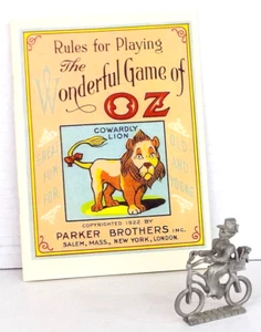 Gioco Mago di Oz repro libro delle regole + statuina peltro bicicletta Miss Gulch & Toto - Foto 1 di 6