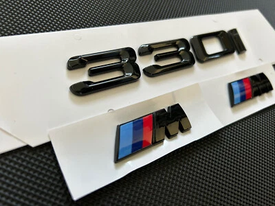 BMW 330i BADGE AND 2X M WING BADGES IN GLOSS BLACK - Image 1 of 4