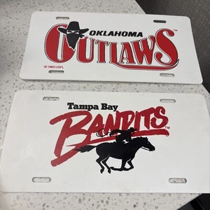 Lot of 2 Oklahoma Outlaws & Tampa Bay Bandits Plastic License Plate Tags USFL - Picture 1 of 9