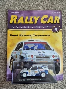 IXO DEAGOSTINI 1/43 FORD ESCORT COSWORTH 1000 LAKES RALLY 1994 COCHE DIECAST + MAG - Imagen 1 de 3