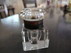 Antique glass inkwell with brass rim